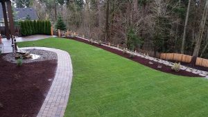 3 retaining walls and steps were built so our clients could use their backyard.